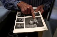 Petr Brandejsky, a 90-year-old Holocaust survivor, points at a picture at his apartment in Prague