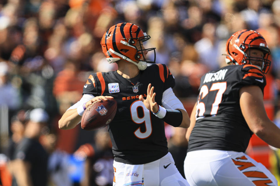 Cincinnati Bengals quarterback Joe Burrow (9) throws a pass for a touchdown against the Atlanta Falcons in the first half of an NFL football game in Cincinnati, Sunday, Oct. 23, 2022. (AP Photo/Aaron Doster)