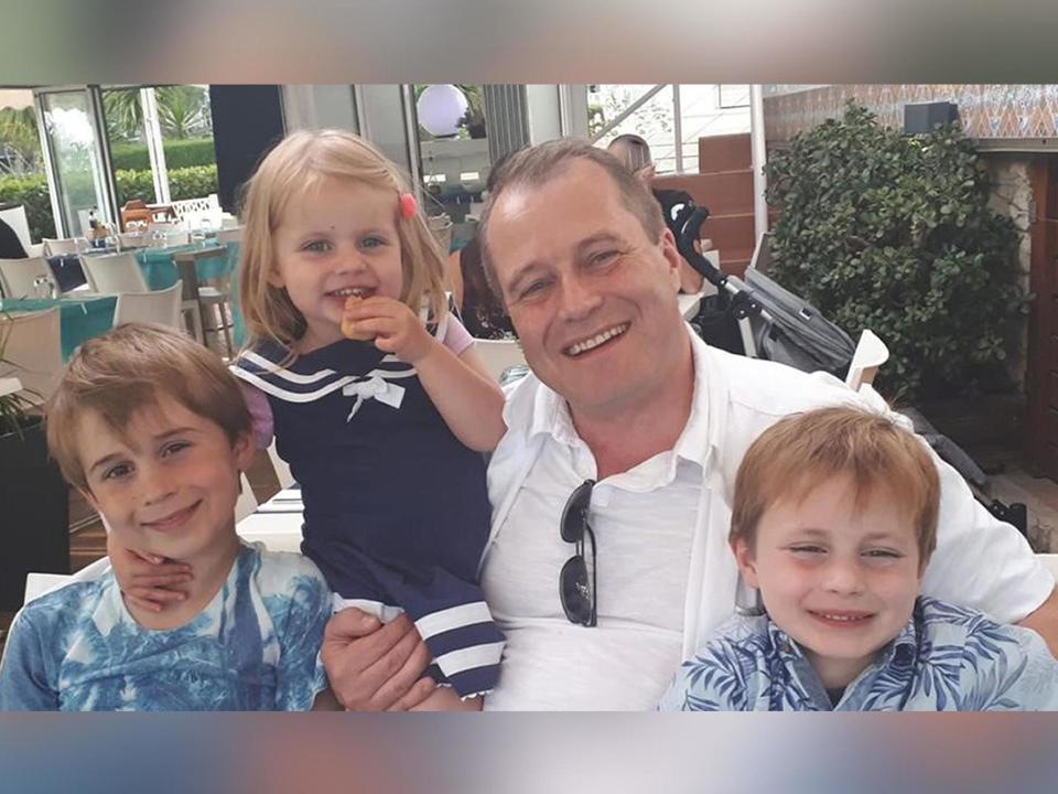 Conor McGinley, 9, Darragh McGinley, 7, and Carla McGinley, 3, with their father Andrew McGinley. The three children were found dead in a house in Parson's Court, in the village of Newcastle on Friday evening: PA