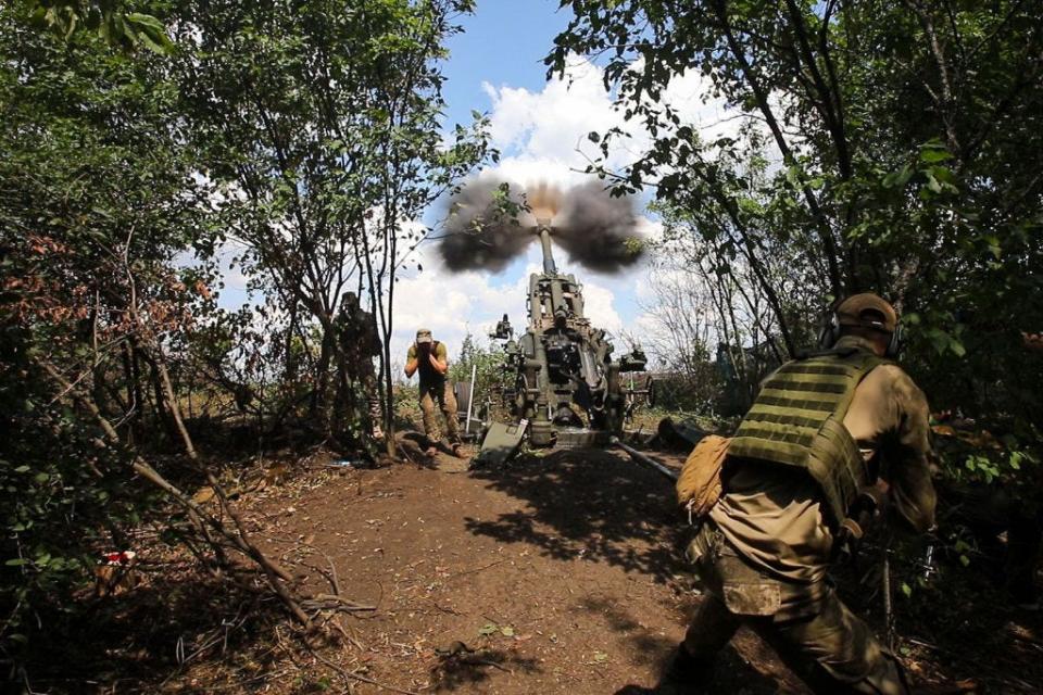 Ukrainian servicemen fire an M777 howitzer, Kharkiv Region, northeastern Ukraine.