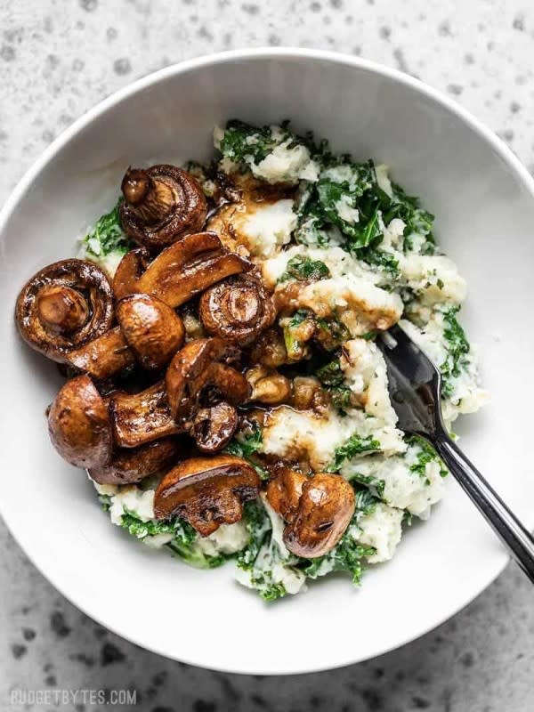 <p>Budget Bytes</p><p>These balsamic roasted mushrooms with herby kale mashed potatoes are a vegetarian meal that will please any "meat and potatoes" style meal lover.</p><p><strong>Get the recipe: <a href="https://www.budgetbytes.com/balsamic-roasted-mushrooms-with-herby-kale-mashed-potatoes/" rel="nofollow noopener" target="_blank" data-ylk="slk:Balsamic Roasted Mushrooms with Herby Kale and Mashed Potatoes;elm:context_link;itc:0;sec:content-canvas" class="link rapid-noclick-resp"><em>Balsamic Roasted Mushrooms with Herby Kale and Mashed Potatoes</em></a></strong></p>