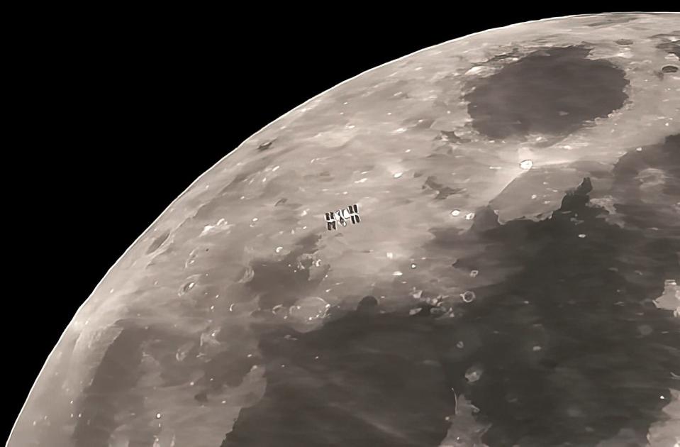 The International Space Station with its two solar panel arrays is shown against the background of the moon in this April 2, 2023 video frame shot through a telescope from Benson. The ISS was on the face of the moon for only about 3/4 of one second.