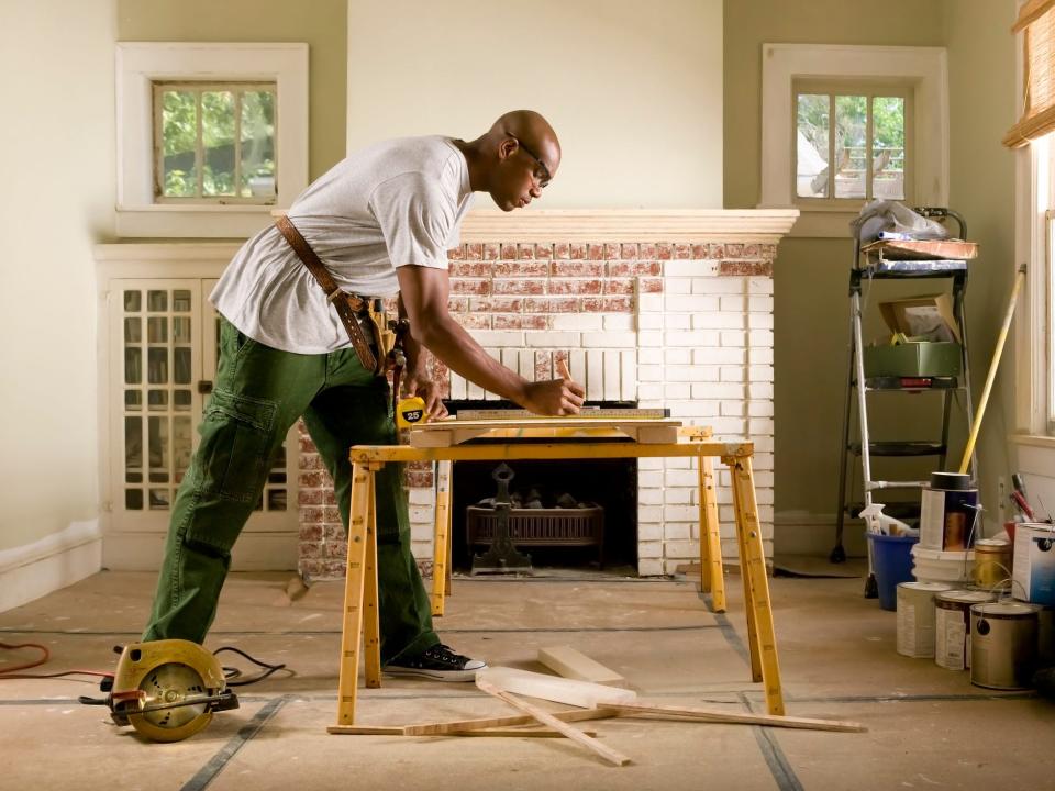 African American man renovating home interior