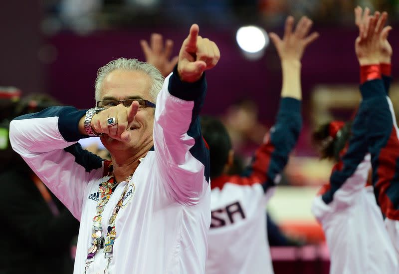 U.S. gymnastics coach John Geddert celebrates during the women's gymnastics team final at the London 2012 Olympic Games