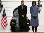 <p>President Barack Obama and first lady Michele Obama bow their heads as they participate in a moment of silence to honor those killed and wounded during a shooting in Tucson, Arizona on January 10, 2011 in Washington, DC. President Barack Obama called on the nation to observe a moment of silence today at 11:00am in honor of those killed and wounded during a shooting rampage in Tucson, Arizona, where six people were killed and wounding atleast 13 others including Rep. Gabrielle Giffords (D-AZ). (Mark Wilson/Getty Images) </p>