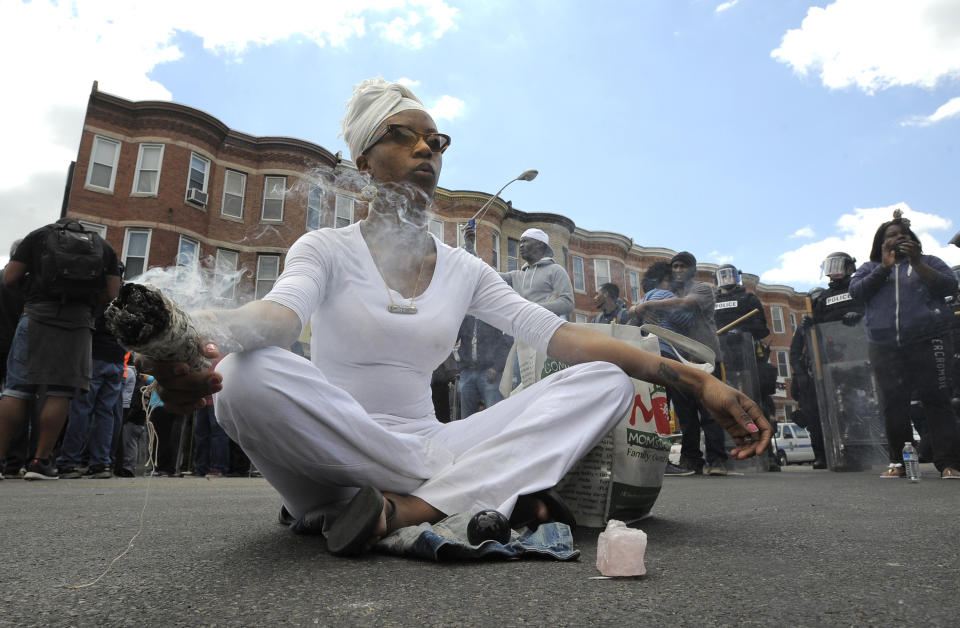 Shawna Murray-Browne burns sage leaves as a way to purify the space on Tuesday, April 28, 2015, in Baltimore, MD, USA. Photo by Lloyd Fox/Baltimore Sun/TNS/ABACAPRESS.COM