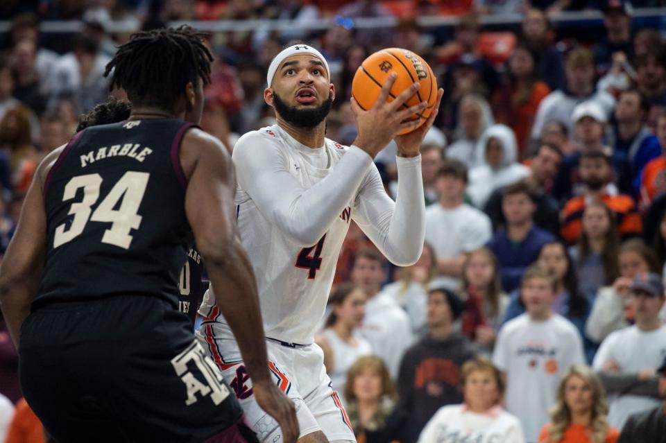 Auburn Tigers forward Johni Broome (4) looks to go up as Auburn Tigers take on Texas A&M Aggies at Neville Arena in Auburn, Ala., on Wednesday, Jan. 25, 2023. Texas A&M Aggies leads Auburn Tigers 45-30 at halftime. 