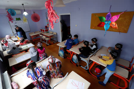 Children attend the Uighur language class at a kindergarten for Uighur children in the Zeytinburnu district, which hosts most of the Uighur exiles, in Istanbul, Turkey, December 14, 2018. REUTERS/Murad Sezer