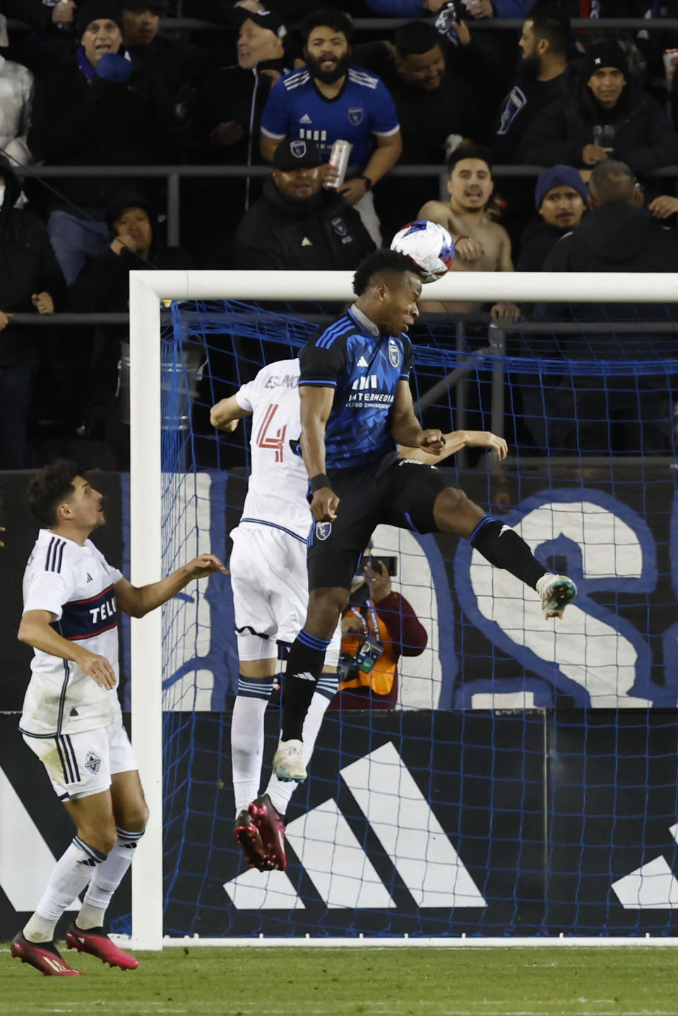 San Jose Earthquakes forward Jeremy Ebobisse, right, scores on a header against Vancouver Whitecaps defender Ranko Veselinovic (4) during the second half of an MLS soccer match in San Jose, Calif., Saturday, March 4, 2023. (AP Photo/Josie Lepe)