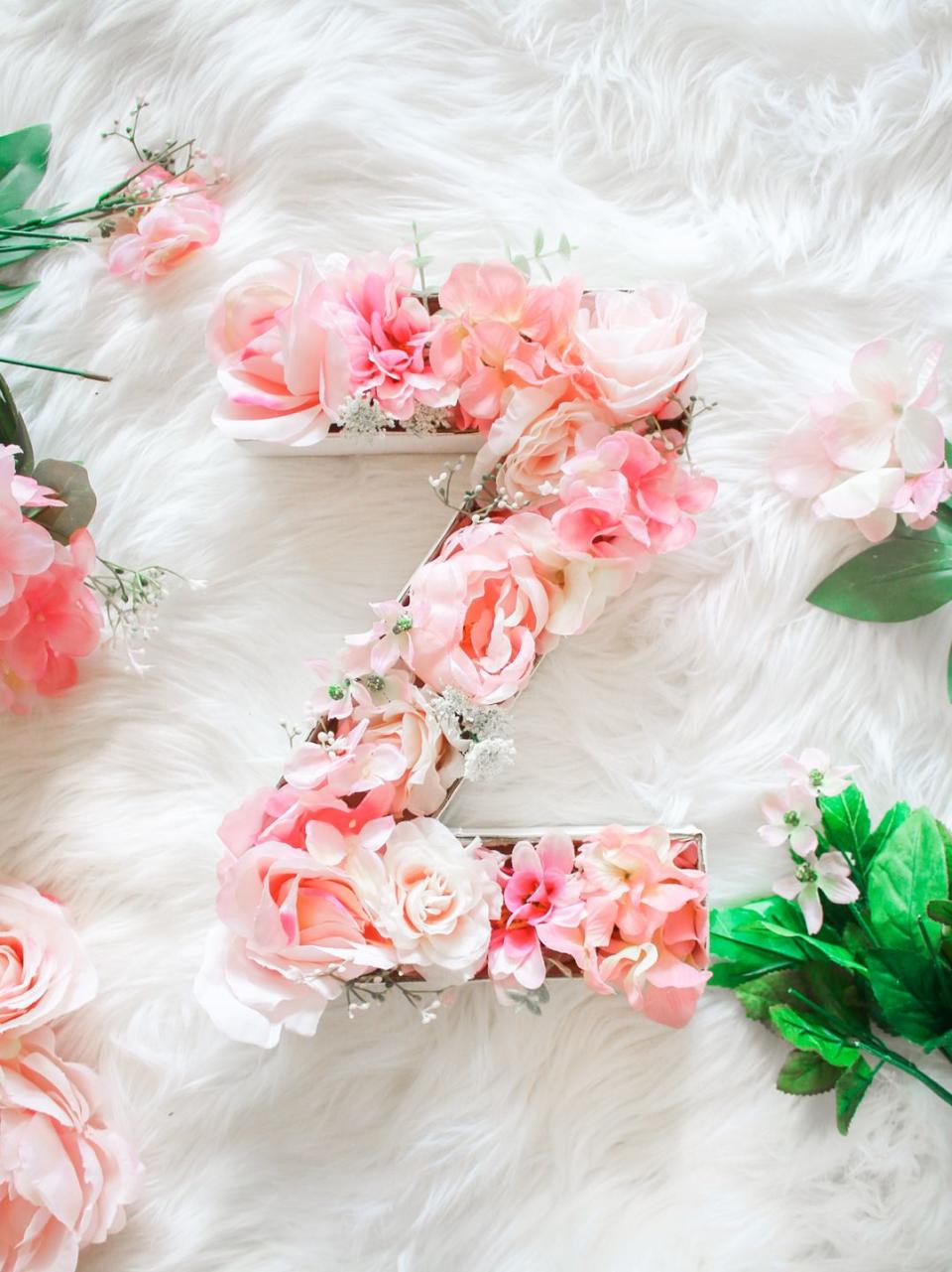 <p>Whether she uses this floral beauty to dress up her door, wall, or shelf, it'll make her smile every time she looks at it. Trust. </p><p><em><a href="https://thediaryofadebutante.com/diy-monogram-door-hanger-flowers/" rel="nofollow noopener" target="_blank" data-ylk="slk:Get the tutorial at Diary of a Debutante »;elm:context_link;itc:0;sec:content-canvas" class="link ">Get the tutorial at Diary of a Debutante » </a></em> </p>