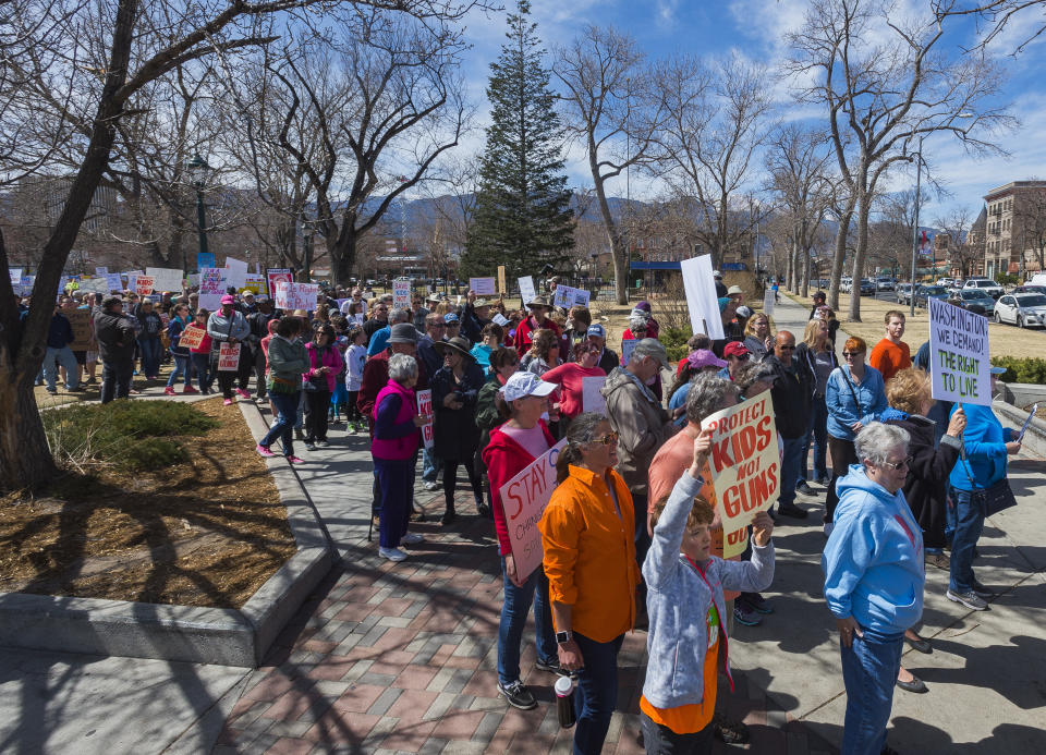 <p>People carry signs and show their support of the ‘March For Our Lives’ event on Saturday March 24, 2018 which started at Acacia Park and proceeded throughout downtown Colorado Springs, Colo. The event gained international attention following the mass school shooting that left 17 dead earlier this year in Parkland, Fla. </p>