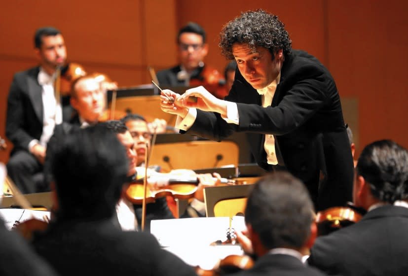 Gustavo Dudamel conducts the Simon Bolivar Symphony Orchestra at Walt Disney Concert Hall on Friday.