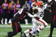 Cleveland Browns running back Nick Chubb (24) runs against Atlanta Falcons linebacker Rashaan Evans (54) during the first half of an NFL football game, Sunday, Oct. 2, 2022, in Atlanta. (AP Photo/John Bazemore)