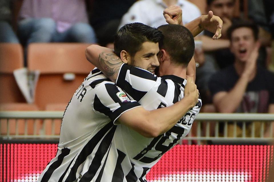 Strong bond: Morata embraces Bonucci during his spell at Juve: AFP/Getty Images