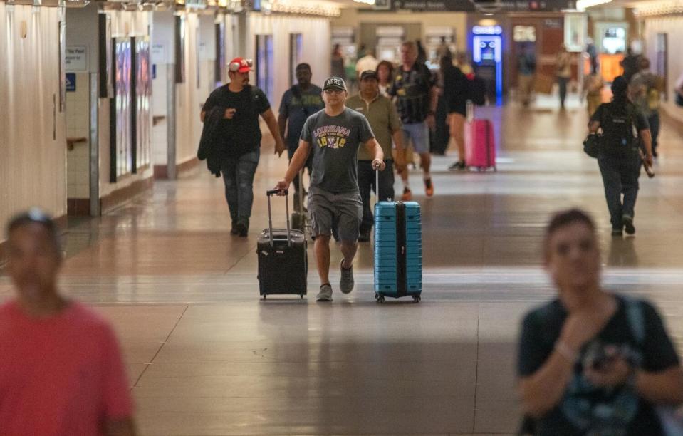 Travelers make their way through Union Station in Los Angeles.