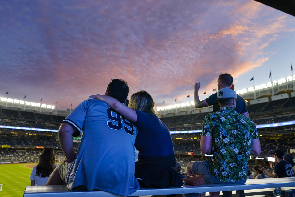 Fans watch during the fifth inning of the second game of a baseball doubleheader between the New York Yankees and the Toronto Blue Jays Thursday, May 27, 2021, in New York. (AP Photo/Frank Franklin II)