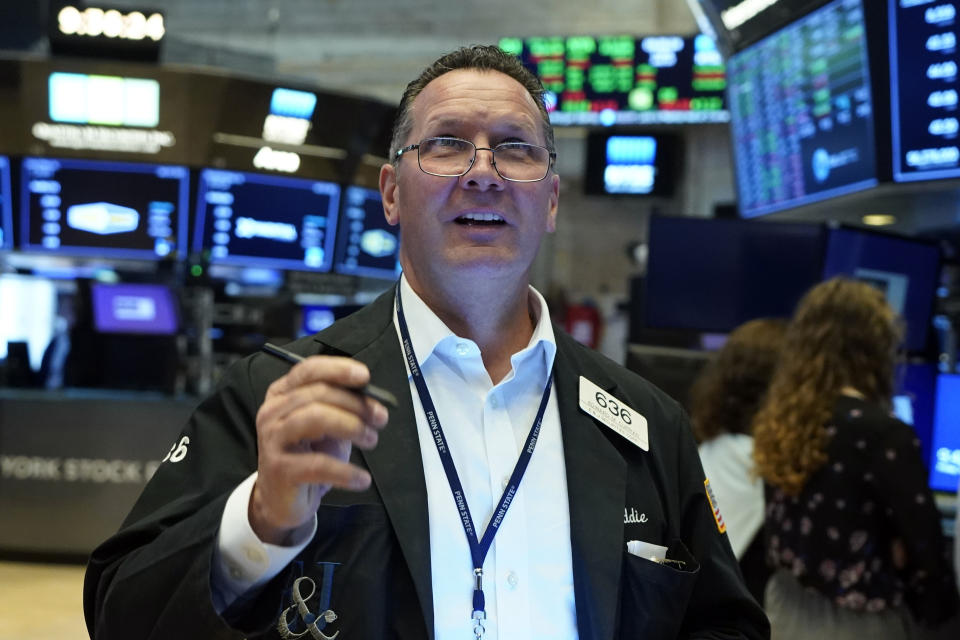 Trader Edward Curran works on the floor of the New York Stock Exchange, Friday, July 23, 2021. Stocks rose in early trading on Wall Street Friday and put the major indexes on track for a strong finish in a week that opened with a stumble. (AP Photo/Richard Drew)