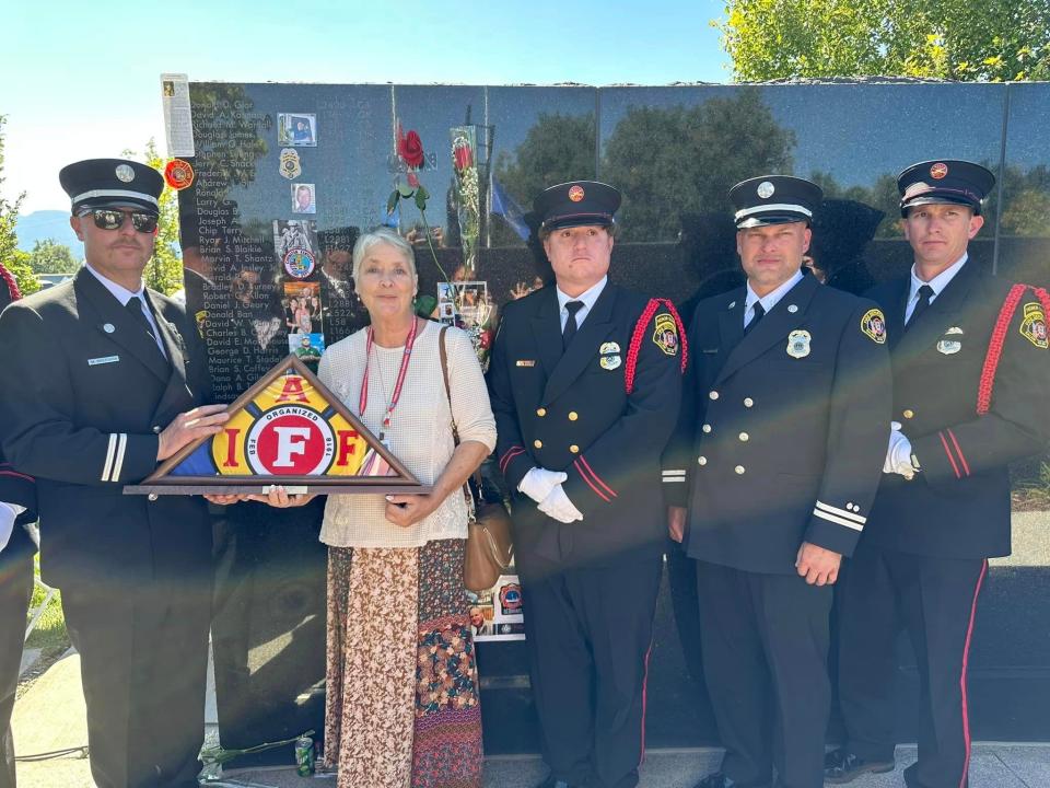 Tina Stadeli at the Fallen Firefighter Memorial in honor of her husband, Maurice "Mo" Stadeli, a Salem firefighter who died of cancer in 2019.