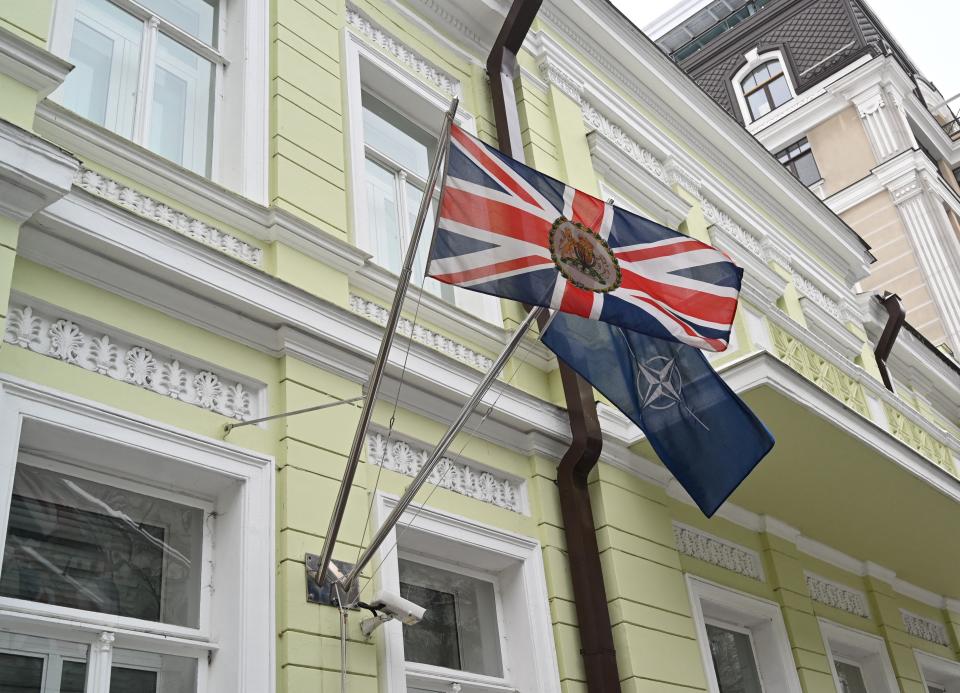 The UK and Nato flags flying on Britain’s Kyiv embassy on 24 January (Sergei Supinsky/AFP via Getty Images)