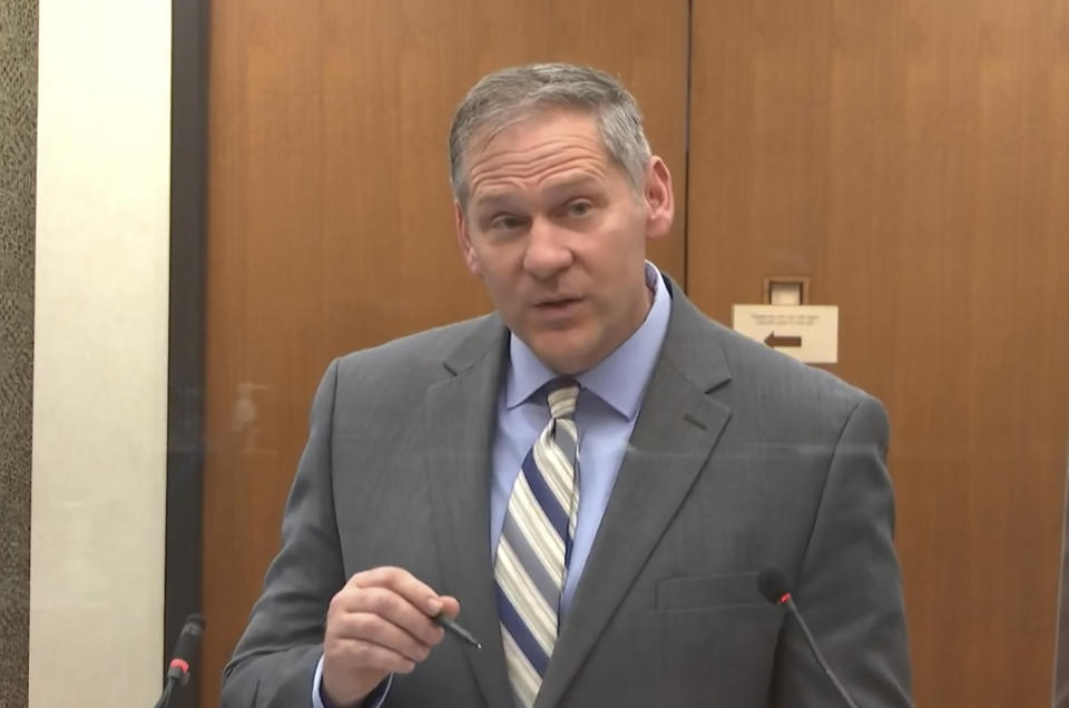 In this image from video, prosecutor Steve Schleicher questions Philonise Floyd, brother of George Floyd, as Hennepin County Judge Peter Cahill presides over court Monday, April 12, 2021, in the trial of former Minneapolis police Officer Derek Chauvin, in the May 25, 2020, death of George Floyd at the Hennepin County Courthouse in Minneapolis, Minn. (Court TV via AP, Pool)