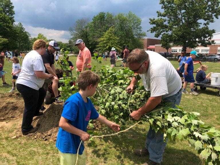 Pictured in June 2023, students at Abbot-Downing School in Concord help to plant trees donated by the state’s Division of Forests and Lands.