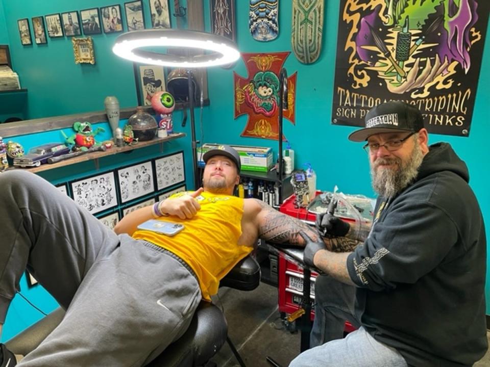UI senior Dylan Bartels, 22, and tattoo shop owner Matt Johnson, 42, say the lack of clear information about the investigation is fuelling fear and rumour (Sheila Flynn)