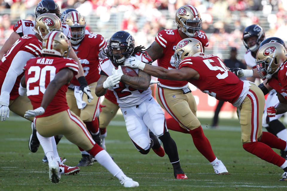 Atlanta Falcons running back Devonta Freeman, center, runs against the San Francisco 49ers during the first half of an NFL football game in Santa Clara, Calif., Sunday, Dec. 15, 2019. (AP Photo/Josie Lepe)