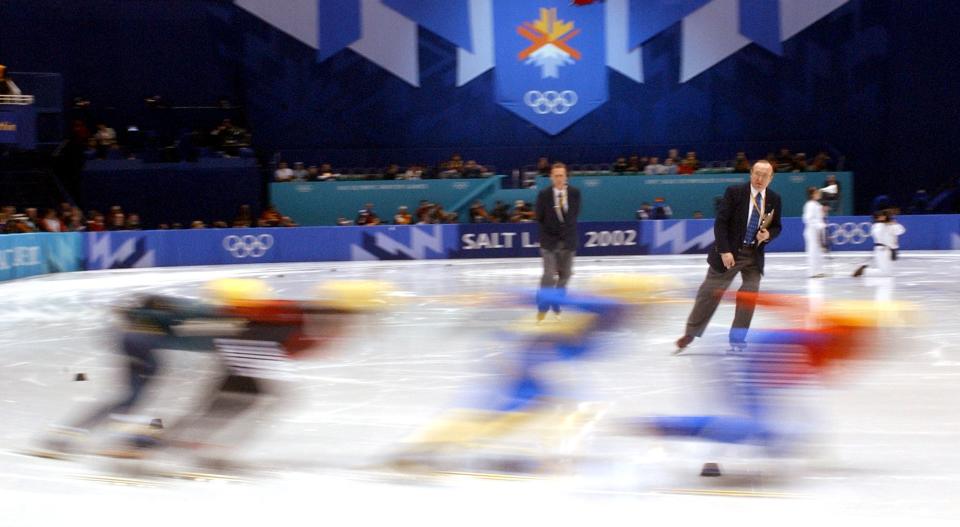 Judges watch racers take a corner in the men’s 1,000 meter short-track speedskating heats at the Salt Lake Ice Center on Feb. 13, 2002. | Jason Olson, Deseret News