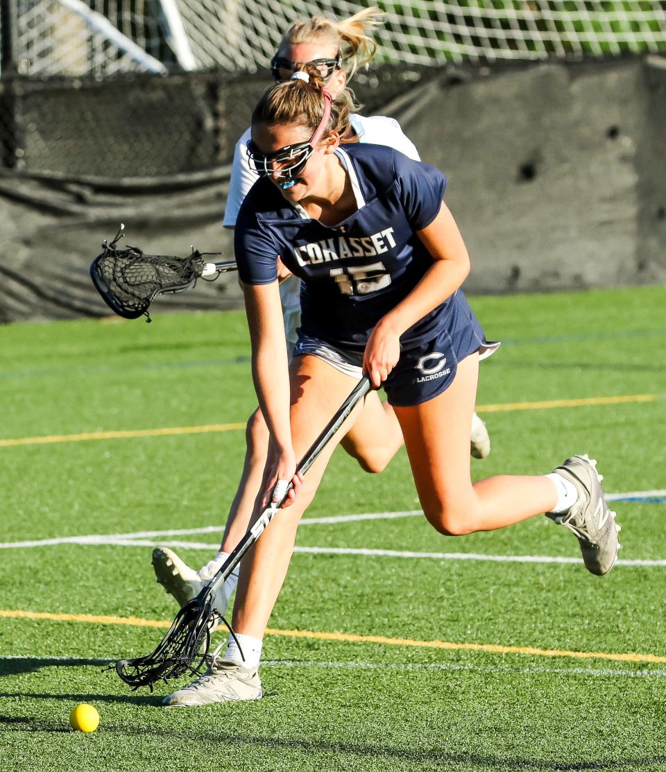 Cohasset's Laney Larsen scoops up a ground ball during the Division 3 state title game against Medfield at Babson College in Wellesley on Tuesday, June 21, 2022.