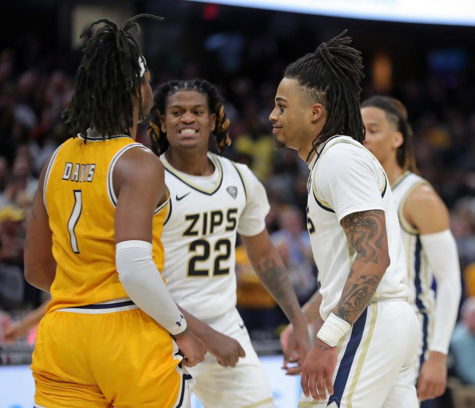 Akron Zips guard Greg Tribble (2) smiles in the face of Kent State Golden Flashes forward VonCameron Davis (1) after sinking the game-winning free throw during the second half of the Mid-American Conference Tournament championship game at Rocket Mortgage FieldHouse, Saturday, March 16, 2024, in Cleveland, Ohio.