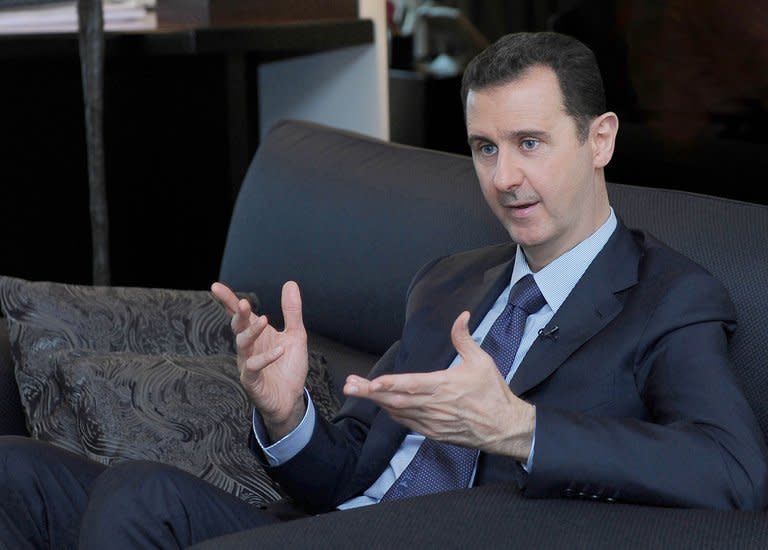 Syrian President Bashar al-Assad gives an interview to Russian newspaper Izvestia in Damascus on August 26, 2013, in a photo released by the Syrian Arab News Agency (SANA)