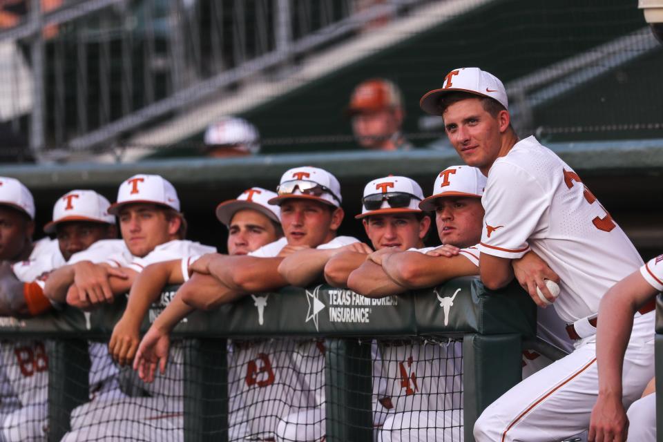Texas players watch from the dugout during the Longhorns' game versus Kansas on Thursday. The Longhorns earned the No. 5 seed in this week's Big 12 Tournament in Arlington and will play Oklahoma State at 9 a.m. Wednesday.