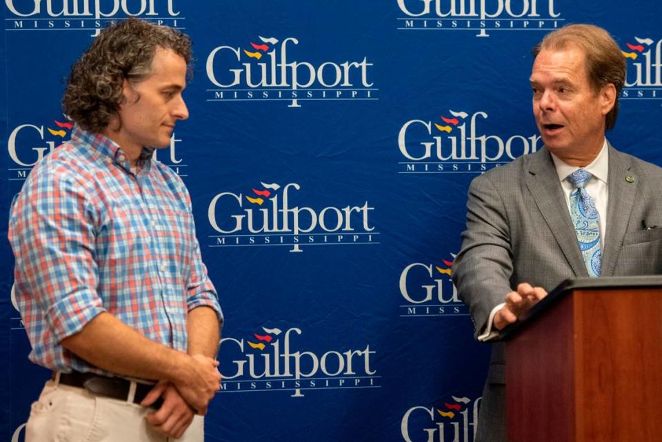 Gulfport Mayor Billy Hewes introduces artist Charles Buckley before unveiling a painting commissioned by Hewes for the 125th anniversary of the city of Gulfport at the Gulfport Police Department on Tuesday, July 18, 2023.