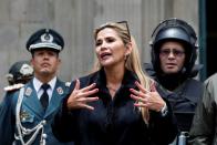 Bolivian Interim President Jeanine Anez takes part in a ceremony with the police in front of the Presidential Palace, in La Paz