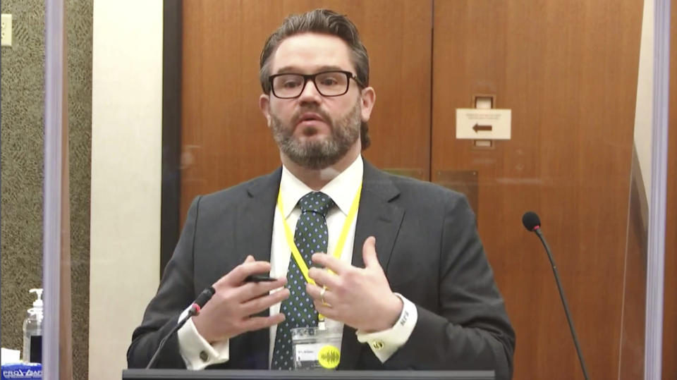 In this image taken from video, defense attorney Eric Nelson questions witness Los Angeles police department Sgt, Jody Stiger, as Hennepin County Judge Peter Cahill presides Wednesday, April 7, 2021, in the trial of former Minneapolis police Officer Derek Chauvin at the Hennepin County Courthouse in Minneapolis. Chauvin is charged in the May 25, 2020 death of George Floyd. (Court TV via AP, Pool)