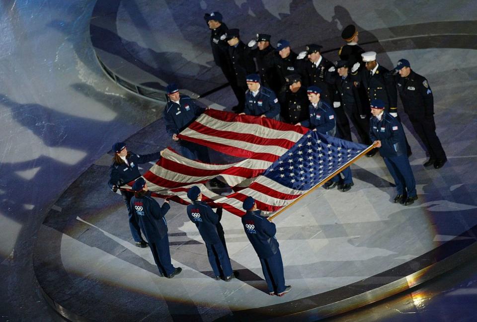 <p>As the United States hosted the 2002 Winter Olympics, the country paid respect to victims of the 9/11 terrorist attacks during the opening ceremony. During the national anthem, the stadium saluted an <a href="https://olympics.com/ioc/news/ground-zero-flag-to-fly-during-olympic-winter-games/" rel="nofollow noopener" target="_blank" data-ylk="slk:American flag found at Ground Zero;elm:context_link;itc:0;sec:content-canvas" class="link ">American flag found at Ground Zero</a>. </p>