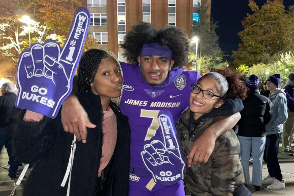 Verna Berry (left), Antwane Wells (middle) and Angel Wells after Antwane’s home game at James Madison on Jan. 2, 2022.