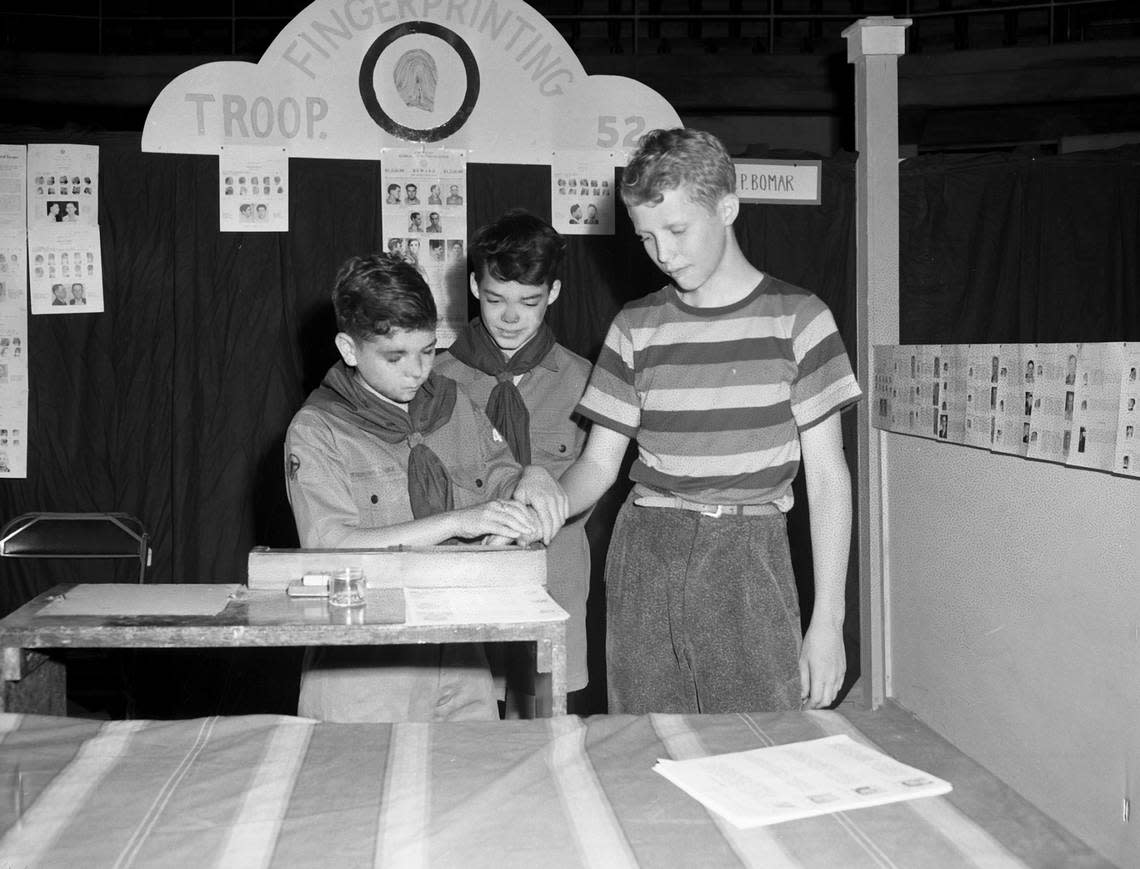 May 1, 1943: The Boy Scouts are holding the Merit Badge Show and Demonstration of Scouting War Skills at Will Rogers Memorial Coliseum. One of the many skills on display is fingerprinting. Scout Bobby Thomas, left, is making prints of Bill Pumphrey, while Scout Billy McLean, center, observes. Fort Worth Star-Telegram archive/UT Arlington Special Collections