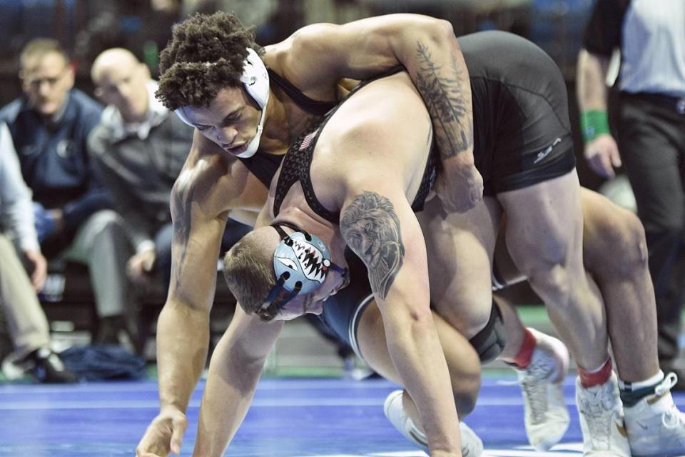 Penn State’s Greg Kerkvliet hangs on to Air Force’s Wyatt Hendrickson in their 285-pound semifinals match of the NCAA Championships on Friday, March 17, 2023 at the BOK Center in Tulsa, Okla. Kerkvliet made the finals with a 4-2 win.