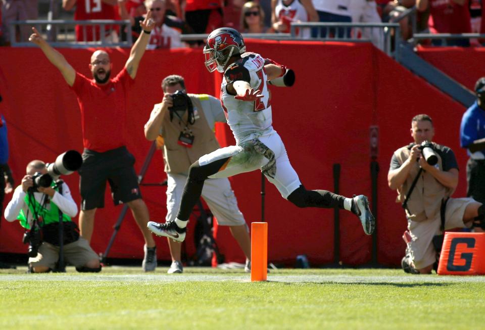 Chris Conte celebrates his pick-six off former teammate Jay Cutler. (Getty Images)