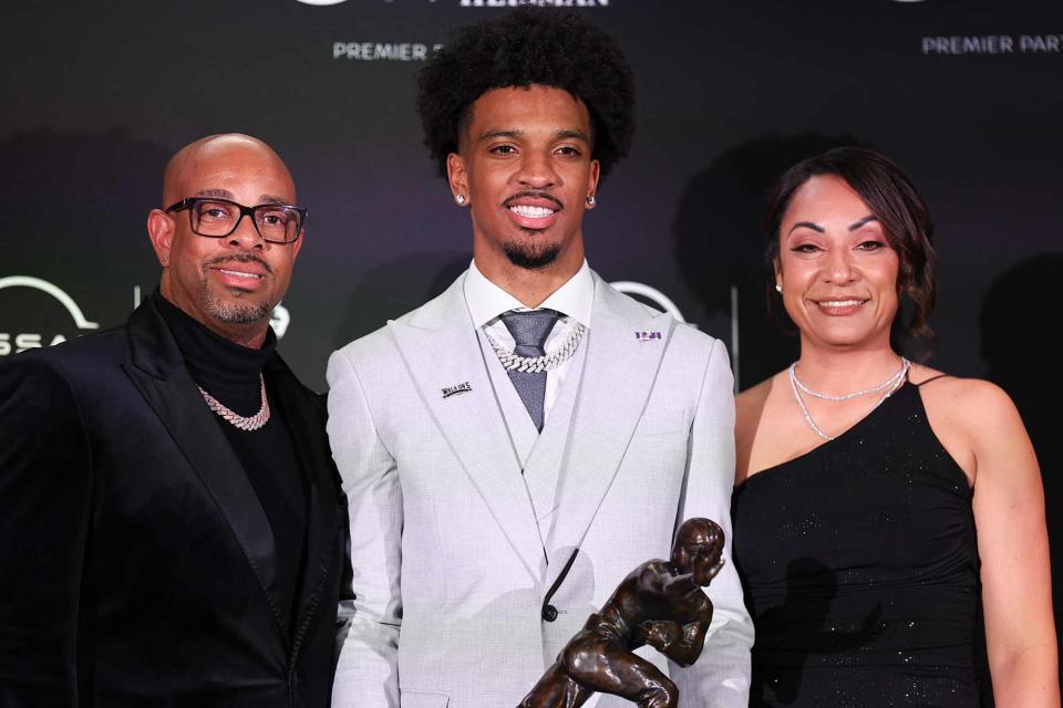 <p>Rich Graessle/Icon Sportswire/Getty</p> Jayden Daniels with his parents after winning the Heisman Trophy on December 9, 2023 in New York City, New York