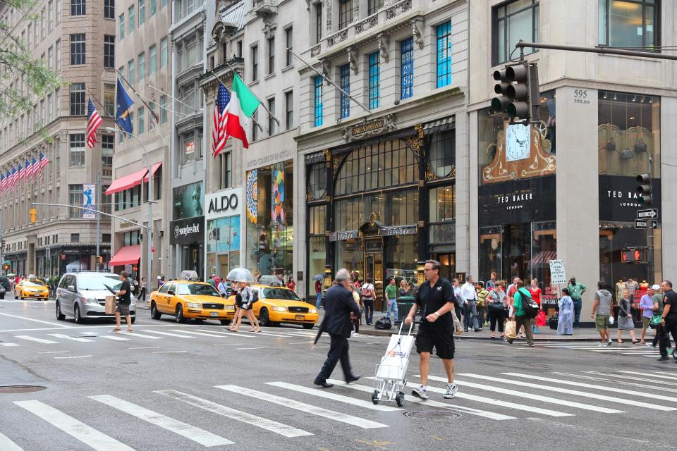 People shop at 5th Avenue, New York. 5th Avenue is ranked the most expensive retail area (per square foot) in the world.