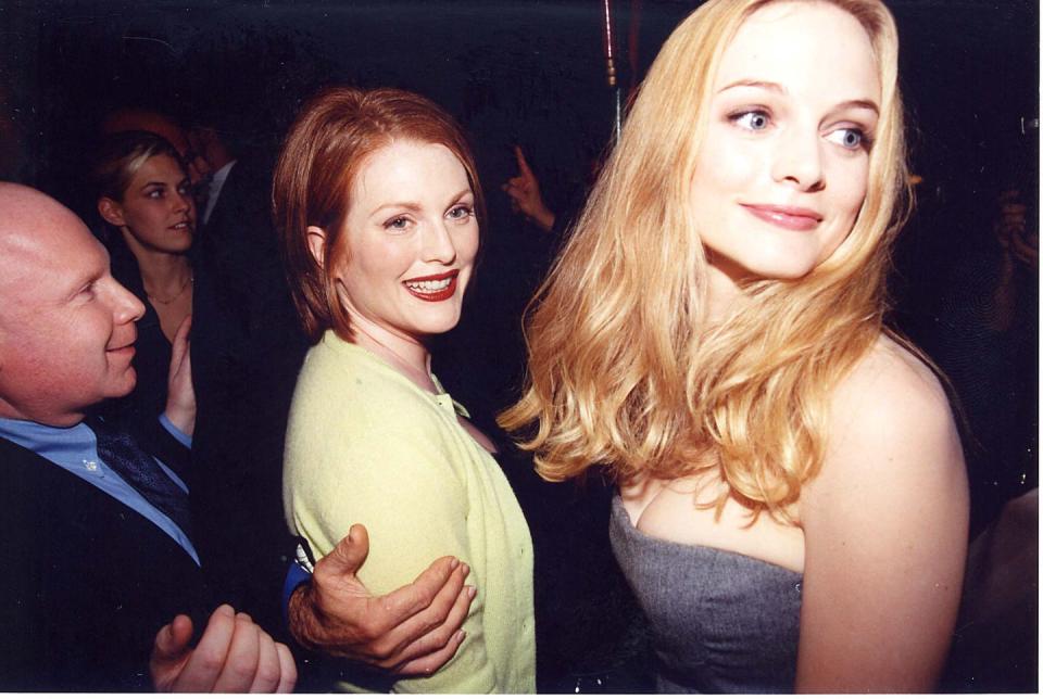 <p>Moore received Academy Award, Golden Globe, and Screen Actors Guild award nominations for her role in director Paul Thomas Anderson’s <em>Boogie Nights</em>, which focuses on a group of people who work in the 1970s porn industry. Here, the actress is pictured attending the movie’s premiere alongside co-star Heather Graham. </p>