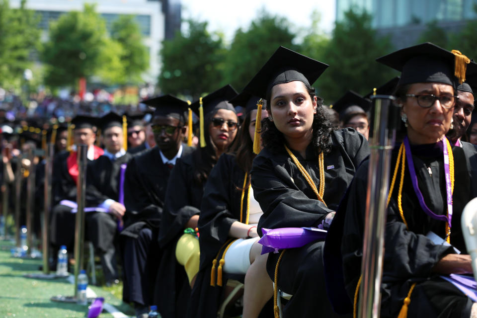 Graduates of The City College of New York sit in their seats at their commencement ceremony in Manhattan on May 31, 2019. REUTERS/Gabriela Bhaskar