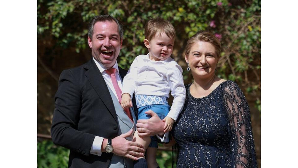 Hereditary Grand Duke Guillaume and Hereditary Grand Duchess Stephanie holding Prince Charles of Luxembourg