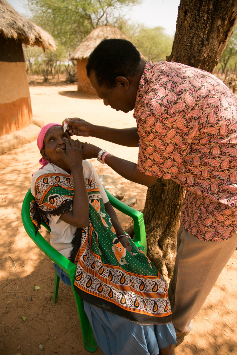 Dr. Michael Makari applies eyedrops to Chepserum&rsquo;s&nbsp;eyes during a follow-up visit. Makari has performed basic surgeries on trachoma sufferers in this remote area of Kenya, helping people like Chepserum to see again. (Photo: Zoe Flood)