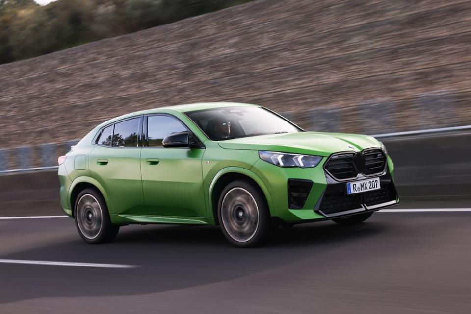 a green car on a road