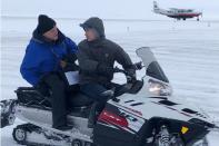 U.S. Census Bureau director Steven Dillingham rides on a snowmobile in Toksook Bay