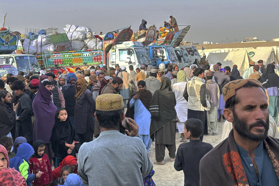 Afghans wait for clearance to depart for their homeland at a deportation camp setup by authorities to facilitate illegal immigrants, in Chaman, a town on the Pakistan-Afghanistan border, Wednesday, Nov. 1, 2023. Pakistani security forces on Wednesday rounded up, detained and deported dozens of Afghans who were living in the country illegally, after a government-set deadline for them to leave expired, authorities said. (AP Photo/Habibullah Achakzai)