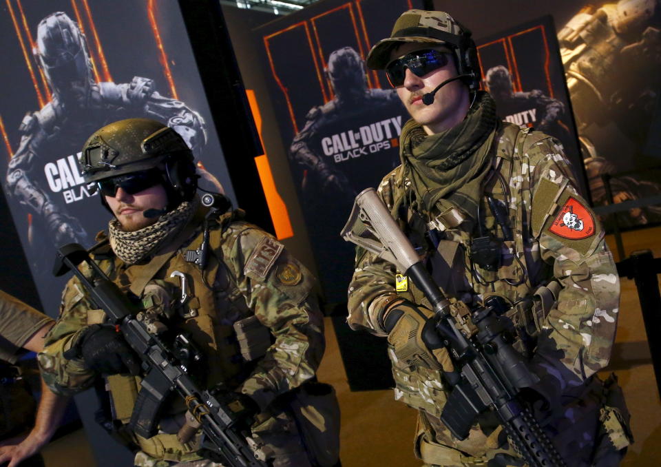 Men are dressed as soldiers to promote the video game 